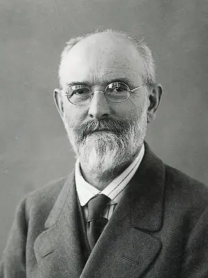 Historical black and white portrait of an elderly bearded man Robert Bosch wearing glasses and formal attire, serious expression, classic studio photography style from the early 20th century