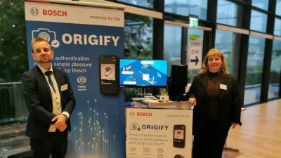 Two experts at the Medical Mountains fair standing in front of our booth